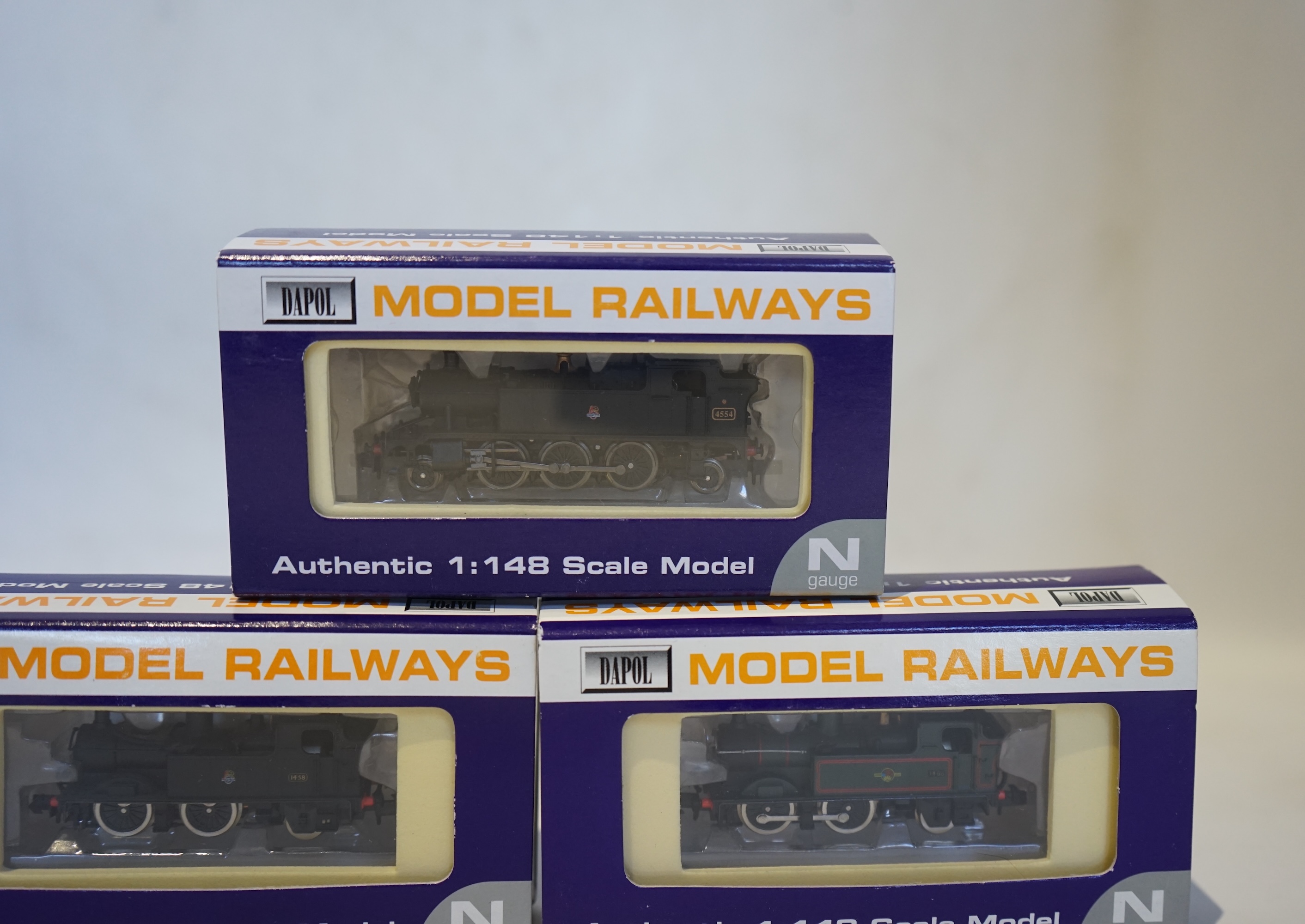 Three boxed Dapol N gauge railway BR tank locomotives; a Class 14xx, 1458 (ND002), a Class 14xx, 1466 (ND003), and a Class 45xx, 4554 (ND-019). Condition - good.